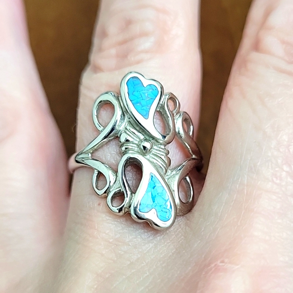 Silver ring with 2 turquoise hearts